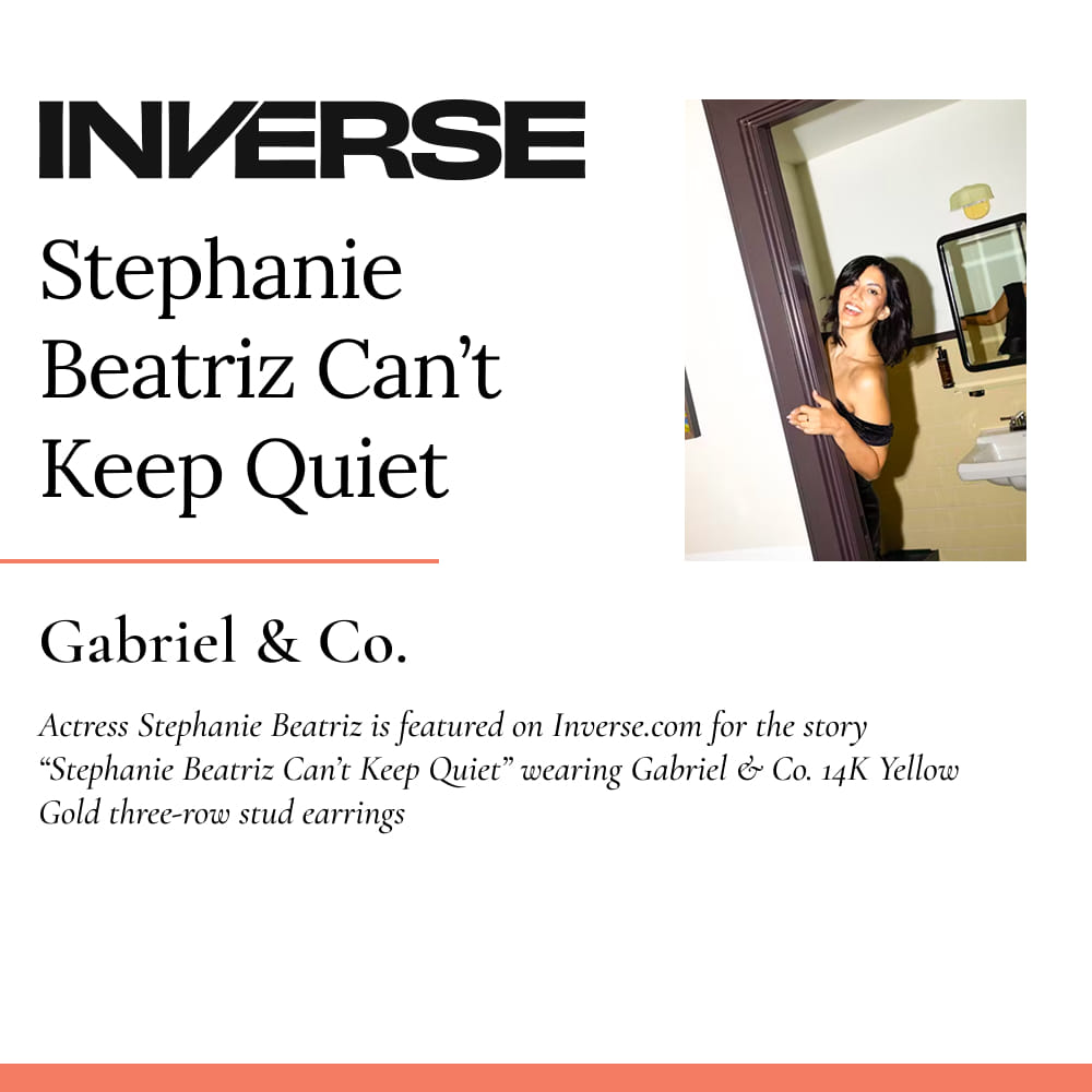 Actress Stephanie Beatriz is featured on Inverse.com for the story “Stephanie Beatriz Can’t Keep Quiet,” wearing Gabriel & Co. 14K Yellow Gold three-row stud earrings