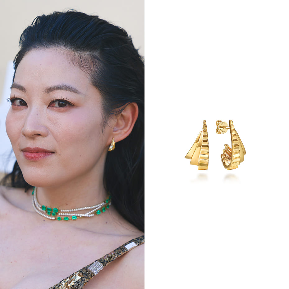 Arden Cho attended the Gold House 5th Annual Gold Gala, wearing Gabriel & Co. graduating J hoop earrings with a diamond cut finish in yellow gold.