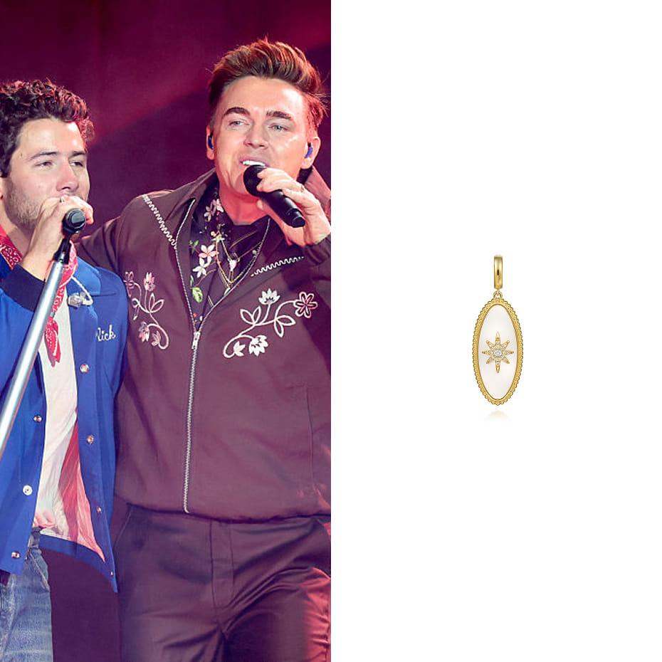 Singer, Jesse McCartney performing with the Jonas Brother's at MetLife Stadium wearing our 14K Yellow Gold Diamond Bujukan Medallion Pendant.