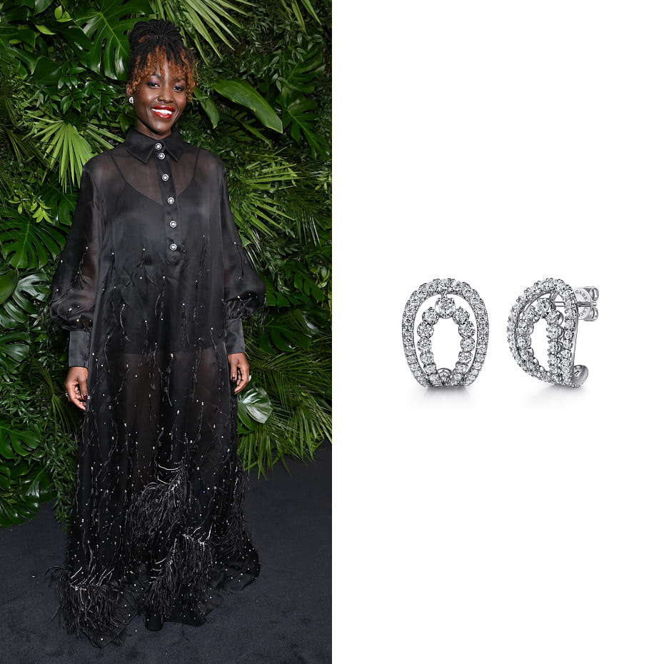 Actress, Lupita Nyong'o, wearing Gabriel & Co. earrings to the CHANEL and Charles Finch Pre-Oscar Awards Dinner
